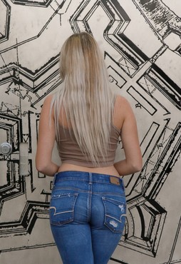 Girl taking off her jeans (Stella Garmen)