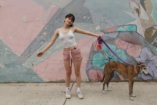 Luci Pineda removes her clothes after walking her dog